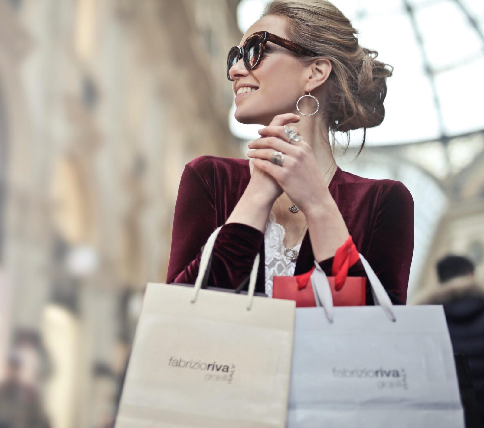 Stylish woman with shopping bags in Galleria Vittorio Emanuele II, Milan.